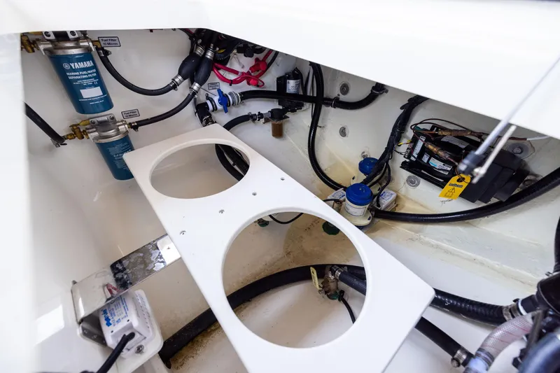 Slide: The Image of 2024 Regulator 34 boat engine compartment with Yamaha fuel filters and wiring. - 47