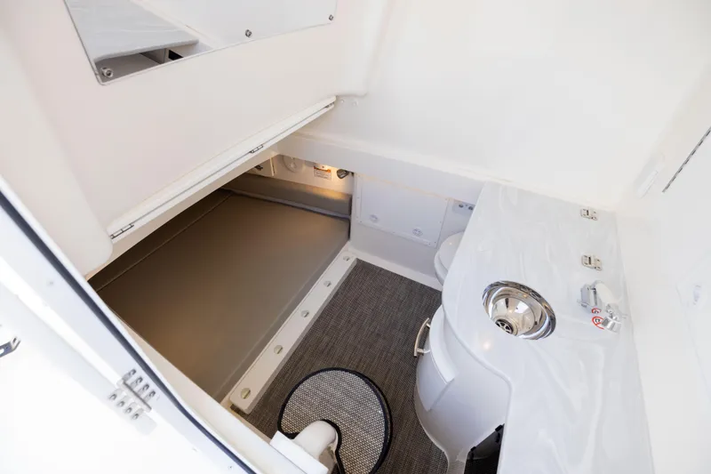 Slide: The Image of 2024 Regulator 34 boat interior with sink and storage area. - 50