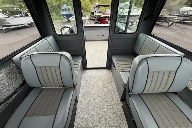 Slide: The Image of Interior of 2026 Alumaweld Intruder 22 HT boat with gray seating and spacious layout. - 10