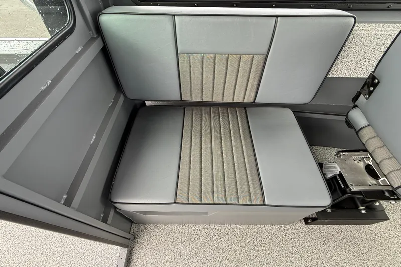 Slide: The Image of Interior seating of 2026 Alumaweld Intruder 22 HT boat, featuring gray upholstery. - 11