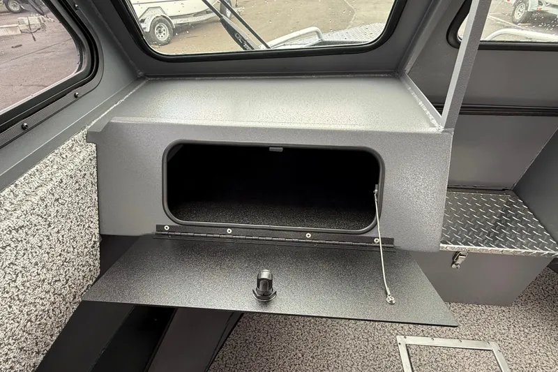 Slide: The Image of Interior storage compartment of 2026 Alumaweld Intruder 22 HT boat. - 12