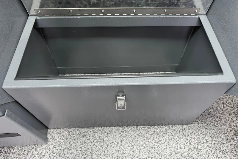 Slide: The Image of Open storage compartment in 2026 Alumaweld Intruder 22 HT boat, featuring a secure latch. - 17