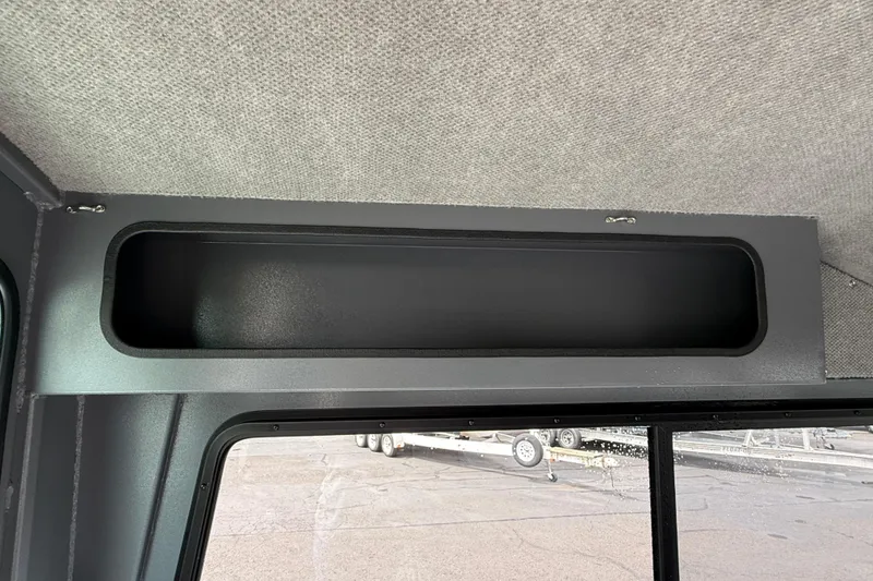 Slide: The Image of Interior storage compartment of 2026 Alumaweld Intruder 22 HT boat. - 20