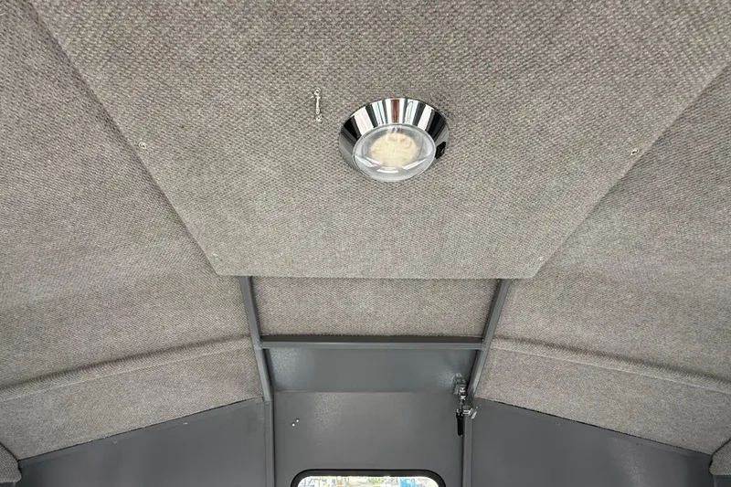 Slide: The Image of Interior ceiling of 2026 Alumaweld Intruder 22 HT boat with light fixture. - 21