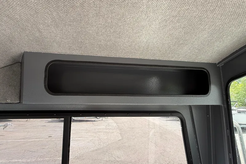 Slide: The Image of Interior storage compartment of 2026 Alumaweld Intruder 22 HT boat. - 22