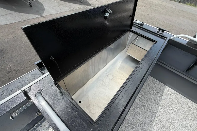 Slide: The Image of Open storage compartment on 2026 Alumaweld Intruder 22 HT boat, showcasing spacious interior. - 28