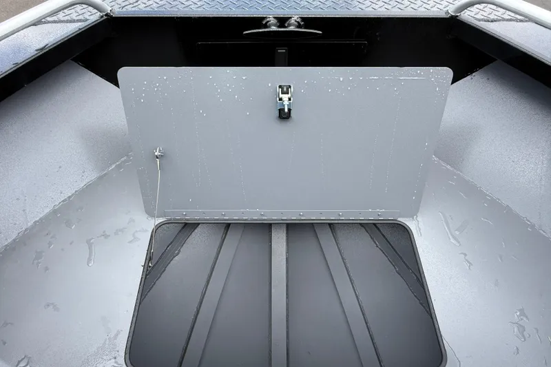 Slide: The Image of 2026 Alumaweld Intruder 22 HT boat interior with open storage compartment. - 31