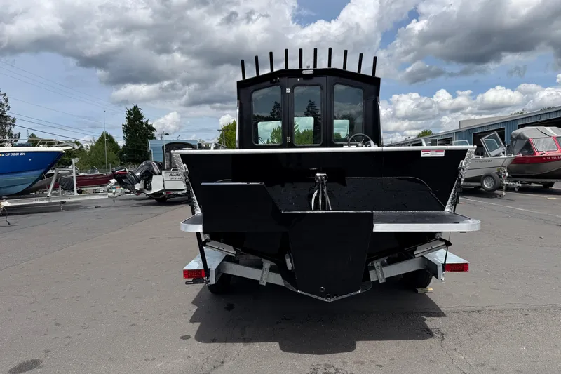 Slide: The Image of 2026 Alumaweld Intruder 22 HT boat rear view in a marina setting. - 34