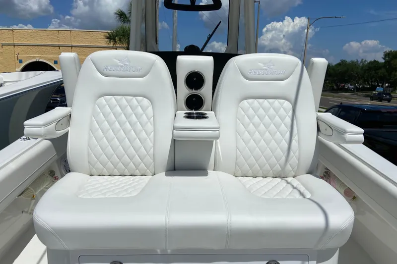 Slide: The Image of Luxury seating on 2026 Regulator 31 boat with white quilted upholstery. - 12