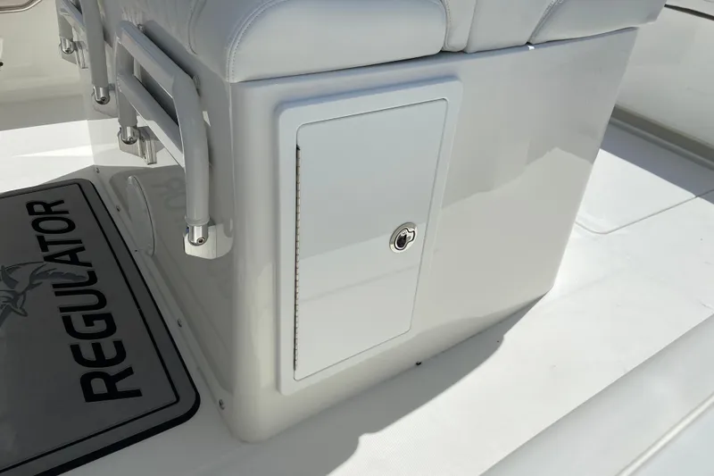 Slide: The Image of 2026 Regulator 31 boat interior with storage compartment and seating. - 14