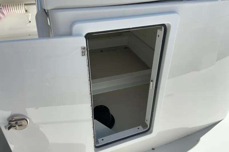 Slide: The Image of Open storage compartment on a 2026 Regulator 31 boat, showcasing interior space. - 15