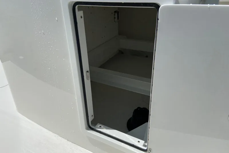 Slide: The Image of Open storage compartment on a 2026 Regulator 31 boat, showcasing interior space. - 17