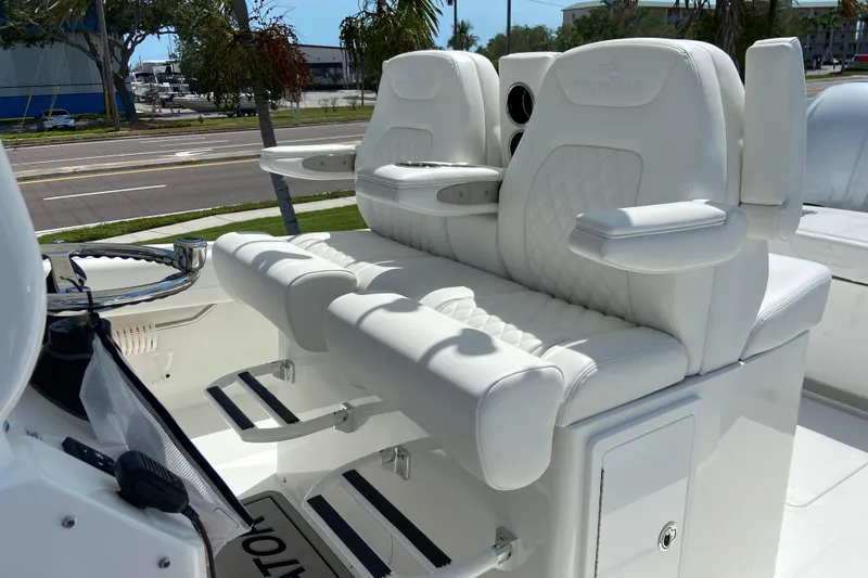 Slide: The Image of 2026 Regulator 31 boat with luxurious white seating and armrests. - 23