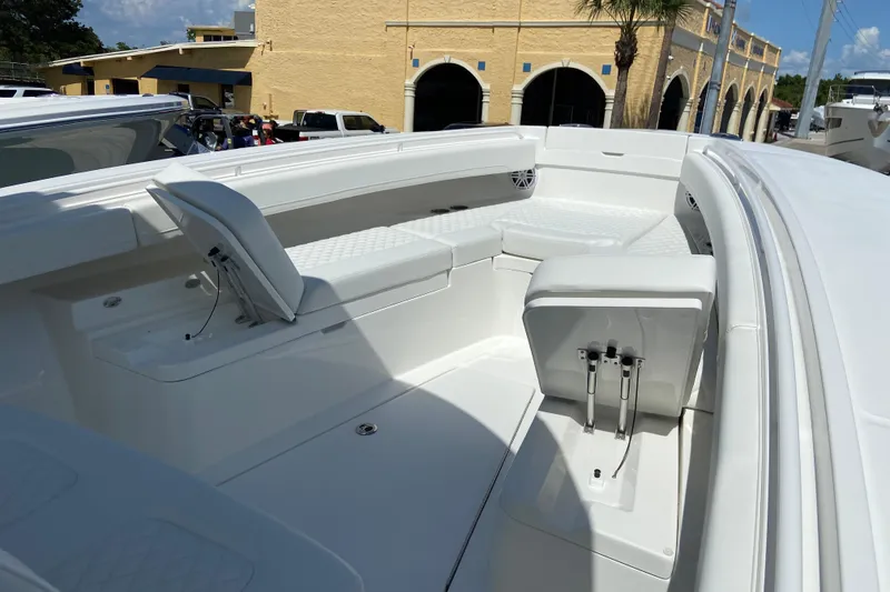 Slide: The Image of 2026 Regulator 31 boat interior with white seating and storage compartments. - 31