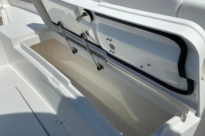 Slide: The Image of Open storage compartment on a 2026 Regulator 31 boat, showcasing interior details. - 34