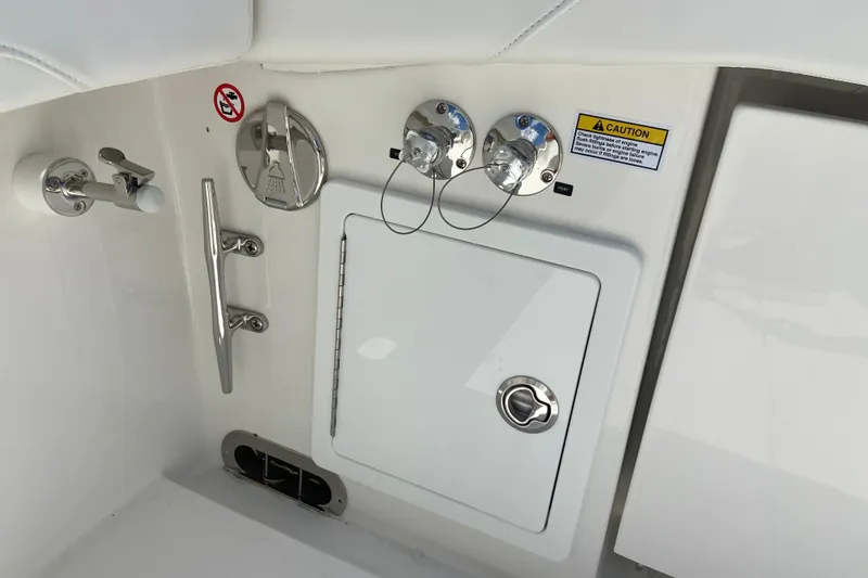 Slide: The Image of 2026 Regulator 31 boat interior with control panel and caution label. - 4