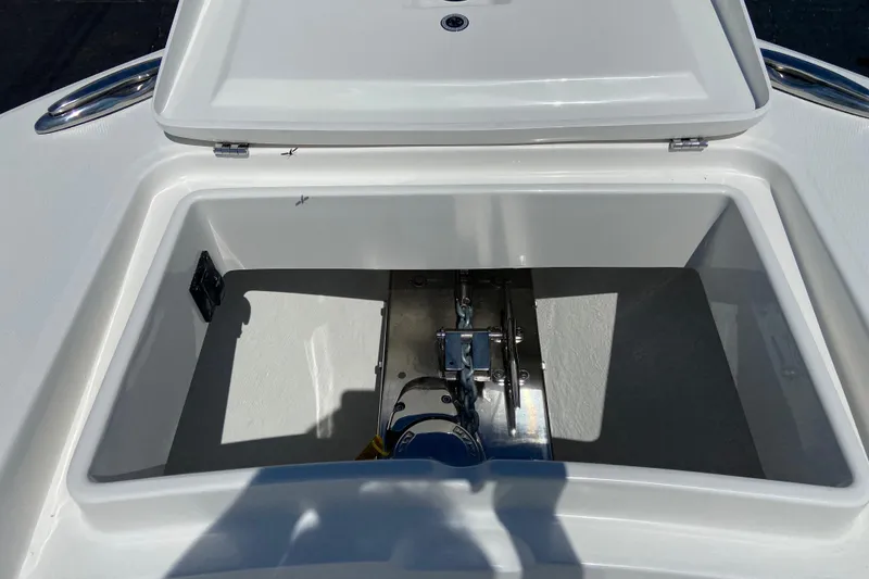 Slide: The Image of Open anchor locker on 2026 Regulator 31 boat, showcasing storage space and hardware. - 40