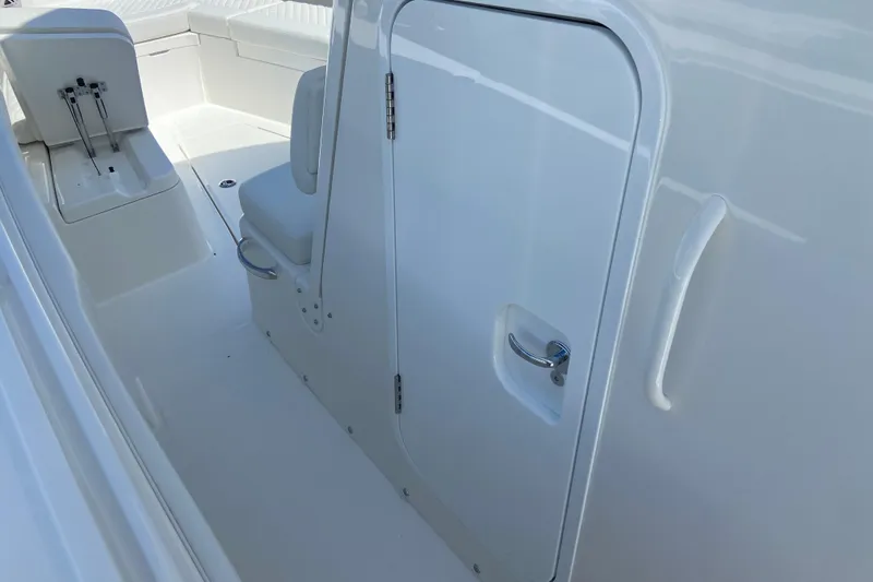 Slide: The Image of 2026 Regulator 31 boat interior with seating and storage compartment. - 43