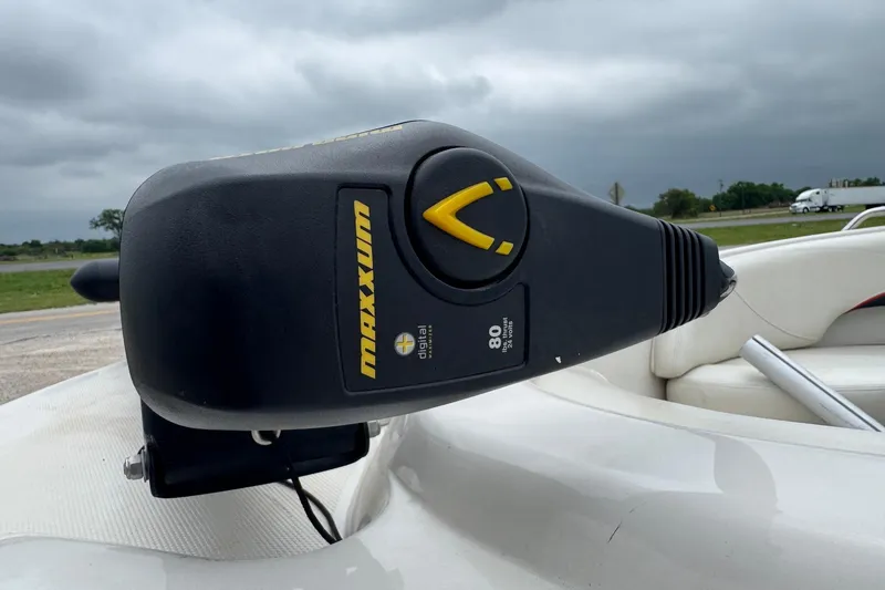 Slide: The Image of Tahoe 195 boat with Maxxum trolling motor, cloudy sky background, 2015 model. - 4