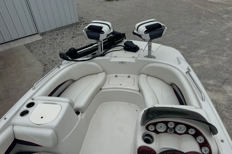 Slide: The Image of 2015 Tahoe 195 boat interior with white seating and dashboard controls. - 6