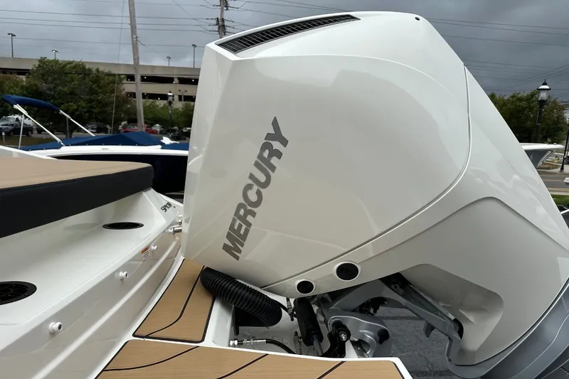 Slide: The Image of A Mercury outboard motor on a Sea Ray SPX 210 boat, featuring sleek details and modern design. - 13