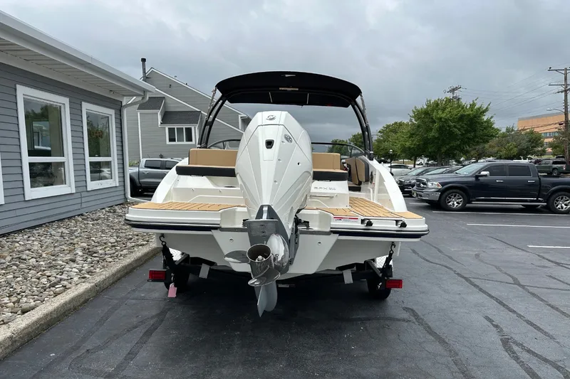 Slide: The Image of A 2027 Sea Ray SPX 210 Outboard is parked. The boat features a sleek, modern design. - 4