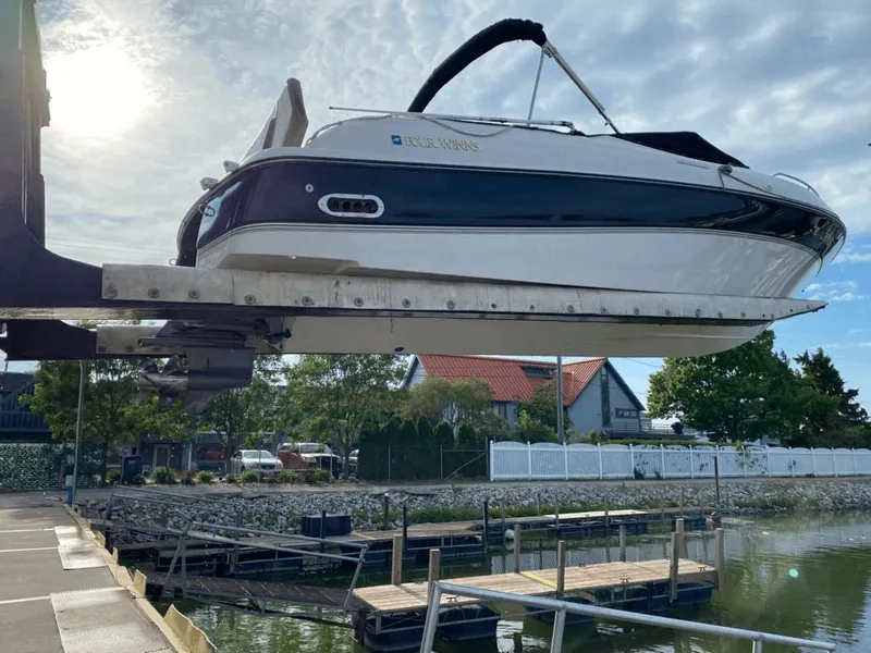 Slide: The Image of 1998 Four Winns 240 Horizon boat at dock during sunset. - 2