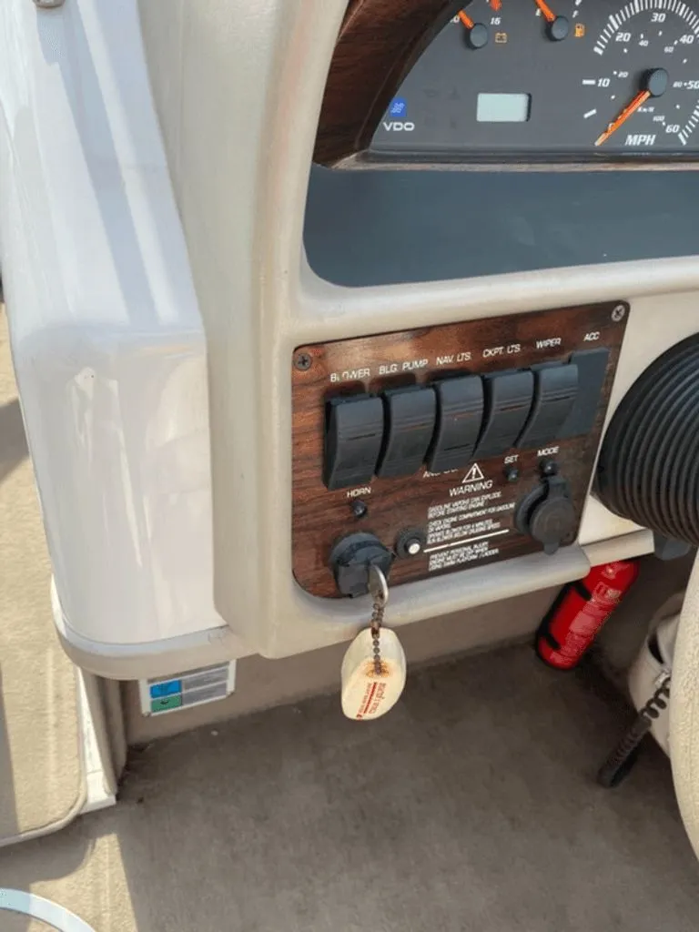 Slide: The Image of Dashboard of a 1998 Four Winns 240 Horizon boat. - 3