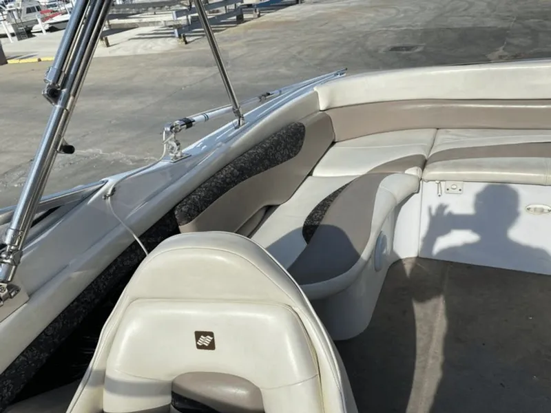 Slide: The Image of Interior of a 1998 Four Winns 240 Horizon boat with seating area. - 5