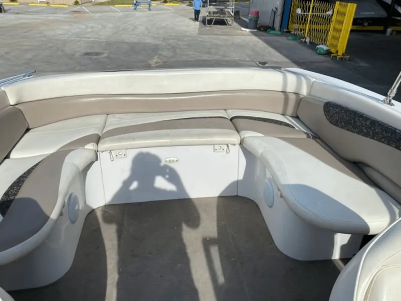 Slide: The Image of Interior of a 1998 Four Winns 240 Horizon boat with seating area. - 8
