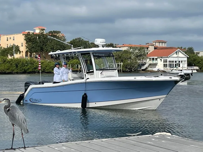 The Image of 2023 Robalo R302 Center Console boat on calm water. - 0