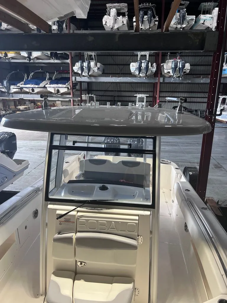 Slide: The Image of 2023 Robalo R302 Center Console in warehouse. - 11