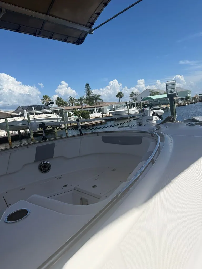 Slide: The Image of 2023 Robalo R302 Center Console boat at dock. - 13