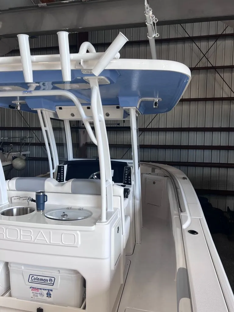 Slide: The Image of 2023 Robalo R302 Center Console boat in warehouse. - 4