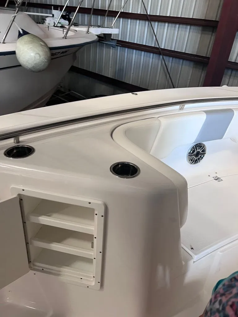 Slide: The Image of 2023 Robalo R302 Center Console in warehouse, deck detail view. - 7