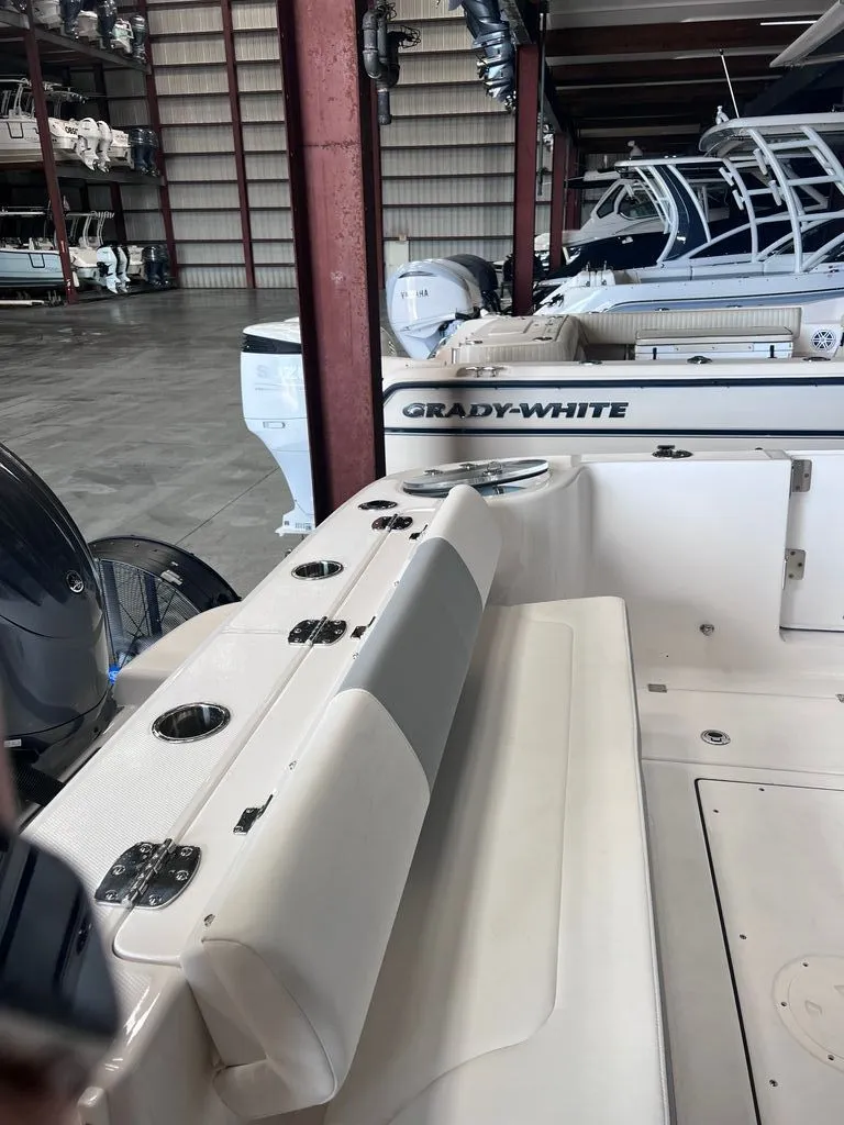 Slide: The Image of Interior view of a 2023 Robalo R302 Center Console boat in storage. - 9