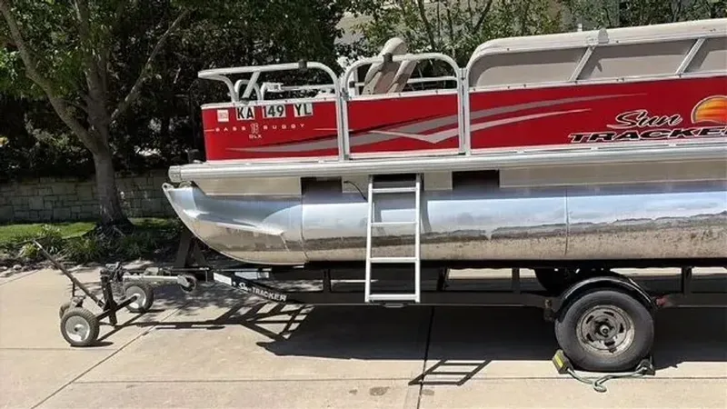 Slide: The Image of 2014 Sun Tracker Bass Buggy on trailer, side view. - 10