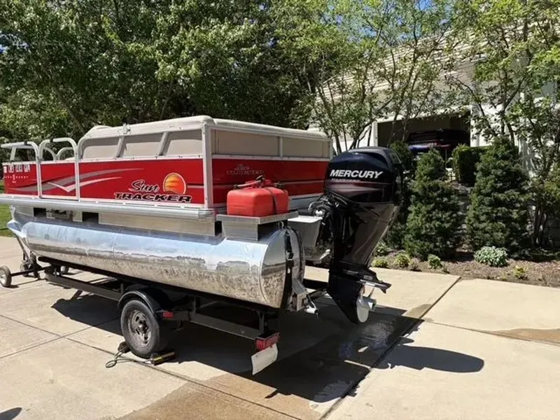 Slide: The Image of 2014 Sun Tracker Bass Buggy with Mercury engine on trailer. - 2