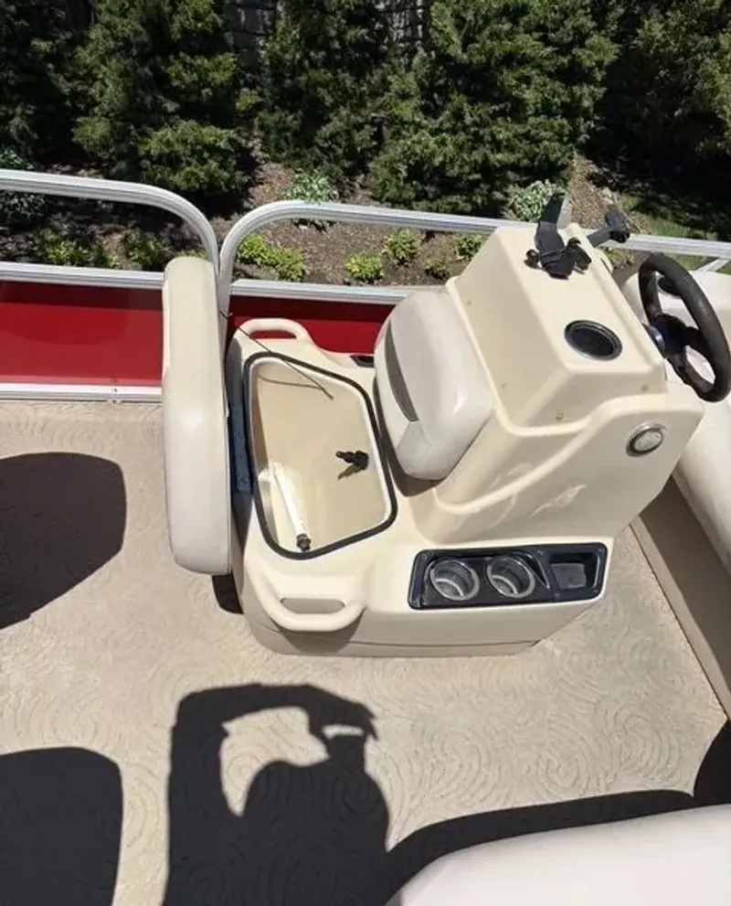 Slide: The Image of 2014 Sun Tracker Bass Buggy console with seat and dashboard. - 3