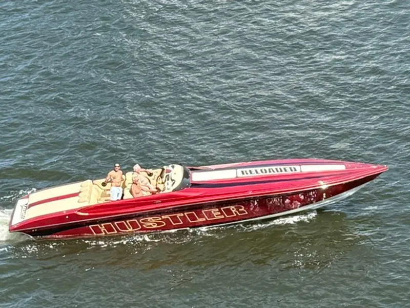 The Image of 2016 Hustler Slingshot speedboat cruising on water. - 0