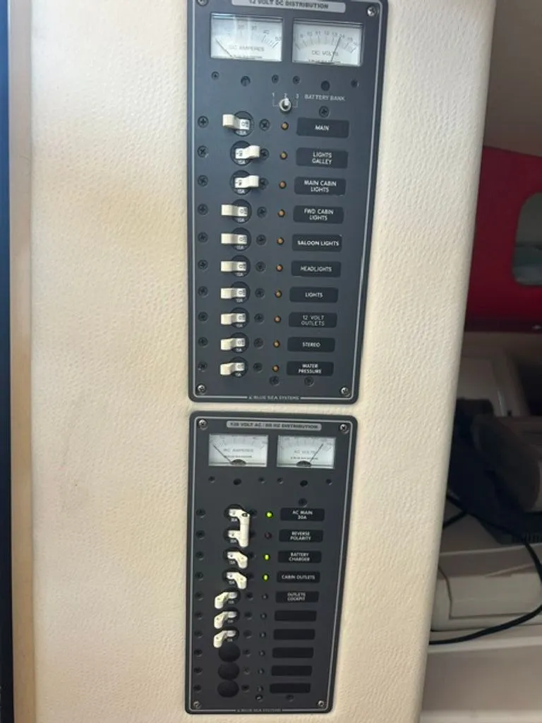 Slide: The Image of 2016 Hustler Slingshot control panel with switches and gauges. - 12