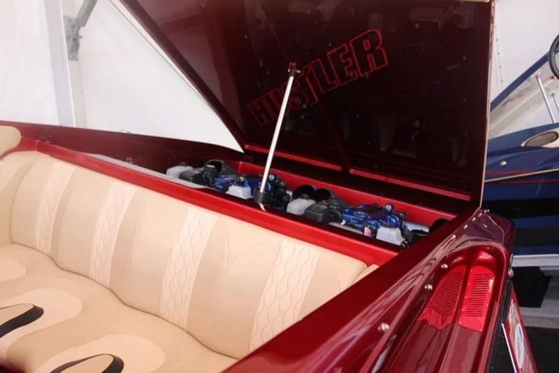 Slide: The Image of 2016 Hustler Slingshot boat with open engine compartment. - 15