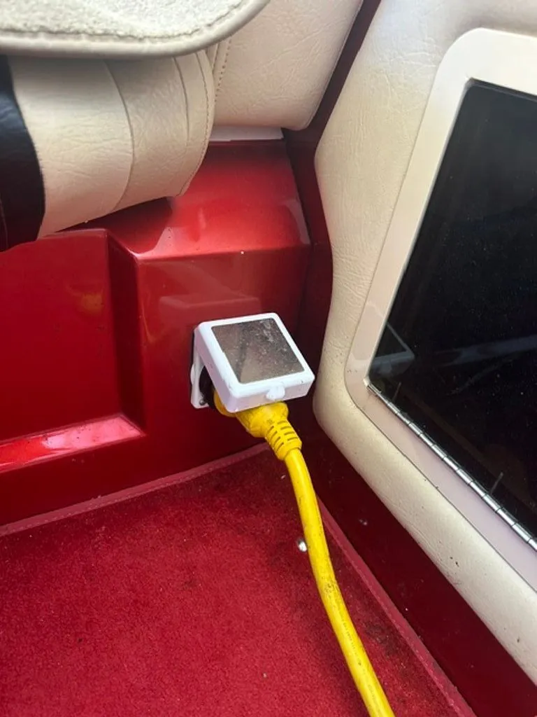 Slide: The Image of Interior of a 2016 Hustler Slingshot with yellow cable. - 19