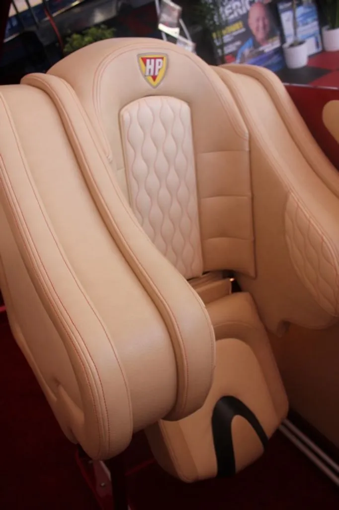 Slide: The Image of Luxurious seat of a 2016 Hustler Slingshot with beige leather. - 2