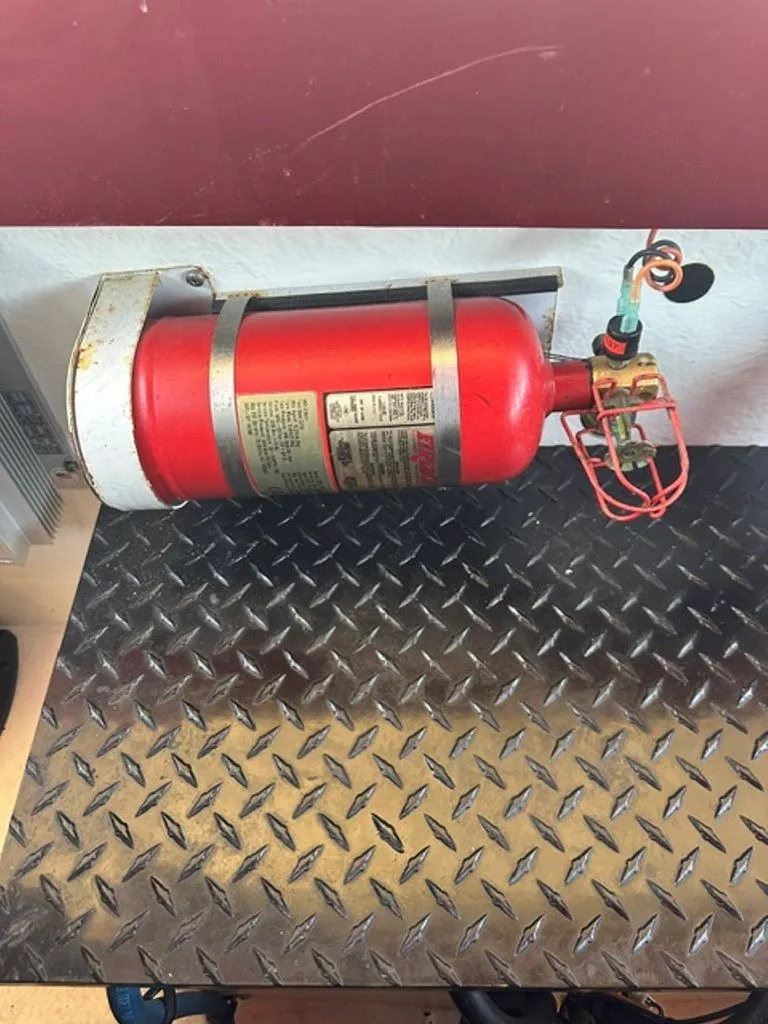 Slide: The Image of Red fire extinguisher on metal plate, Hustler Slingshot 2016. - 20