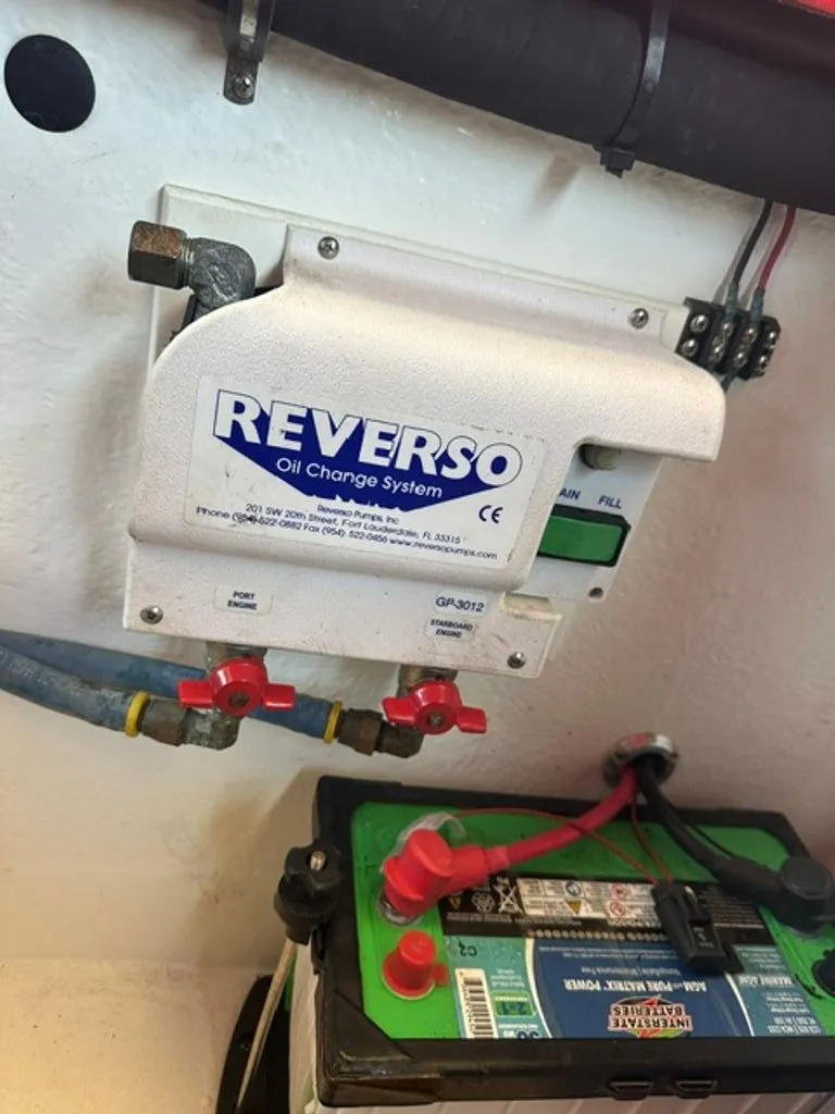Slide: The Image of Reverso oil change system in a 2016 Hustler Slingshot. - 21