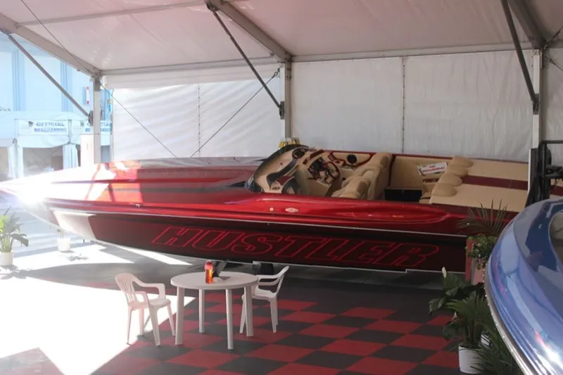 Slide: The Image of 2016 Hustler Slingshot boat in showroom display. - 23