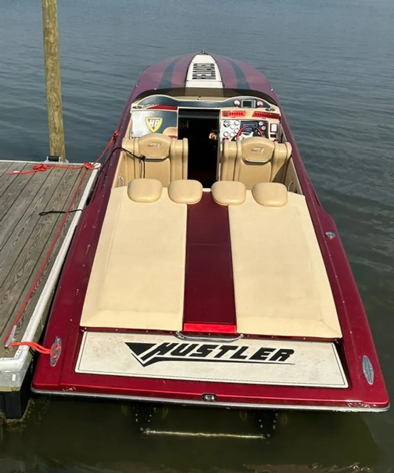 Slide: The Image of 2016 Hustler Slingshot speedboat docked at pier. - 25