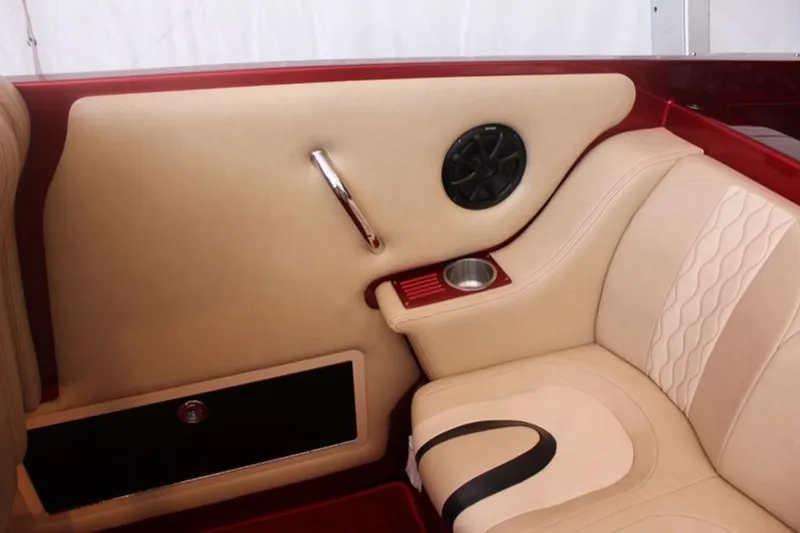 Slide: The Image of 2016 Hustler Slingshot interior with beige leather and speaker. - 6