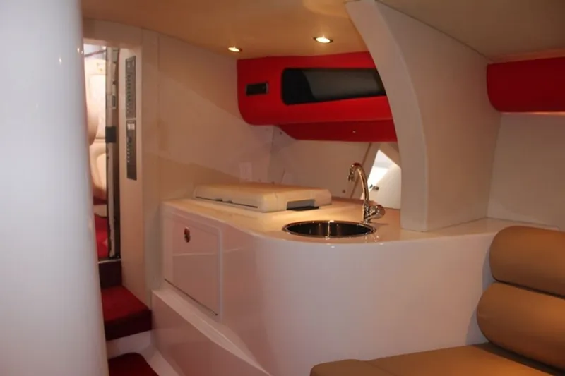Slide: The Image of Interior of a 2016 Hustler Slingshot with modern amenities. - 7